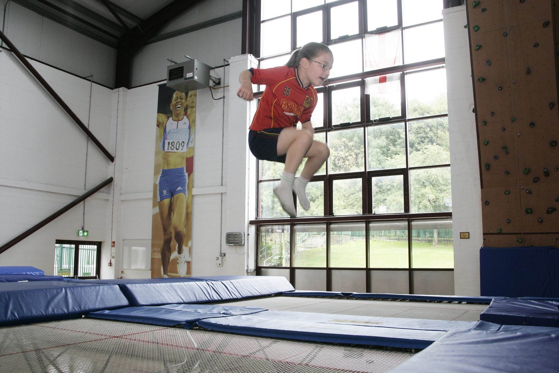 Child enjoying a trampoline activity at a Get Into Sport holiday camp